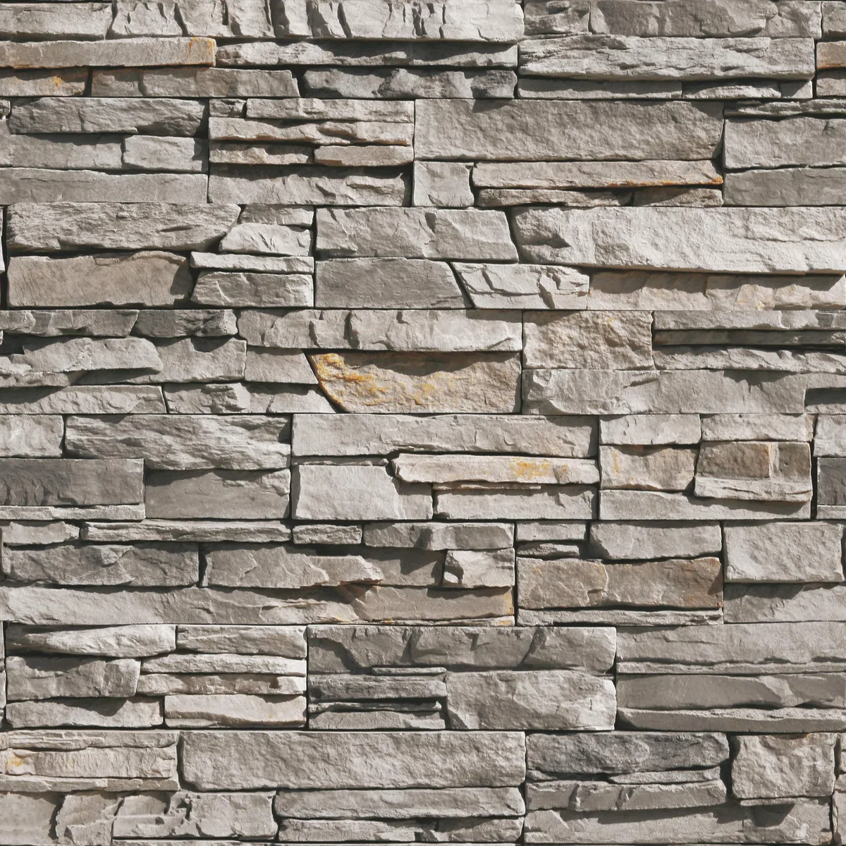 Rivestimento Pietre D'Arredo realizzato con elementi di finitura in vera pietra ricostruita. Sakar Grigio Chiaro. Dimensione cm. 20/30/50x10 H. Unità di vendita scatola da 0,50 metri quadrati.